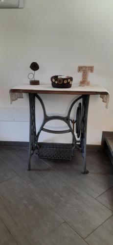 a table in a room with a tableablish at La Tór Appartamenti - Pramotton in Donnas