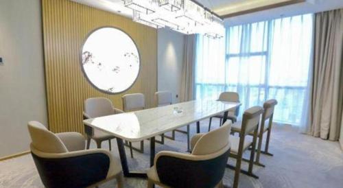 a meeting room with a large table and chairs at Empark Grand Hotel Fuzhou in Fuzhou
