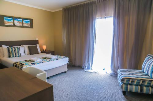 Postel nebo postele na pokoji v ubytování Marina Hotel