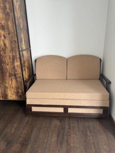 a bed sitting in a corner of a room at Pointview House Gesha in Dryanovo
