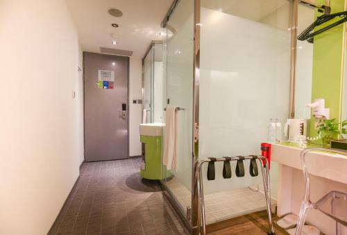 a bathroom with a shower and a walk in shower at CityInn Hotel Taipei Station Branch III in Taipei