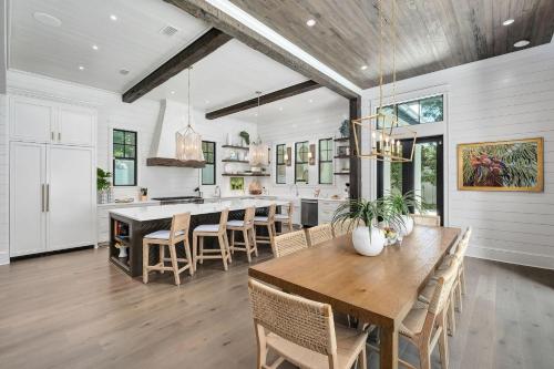 a kitchen and dining room with a table and chairs at Summer Nights in Santa Rosa Beach