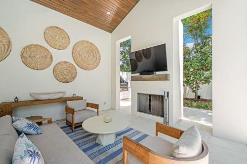 a living room with a couch and a table at Summer Nights in Santa Rosa Beach