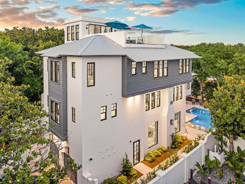 an aerial view of a white house with a pool at Summer Nights in Santa Rosa Beach