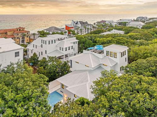 an aerial view of a white building with trees at Summer Nights in Santa Rosa Beach