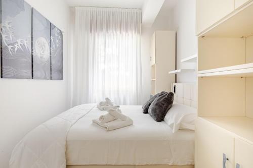 Katil atau katil-katil dalam bilik di Exclusive Apartament e Depandance - Vle Dante - Riccione - Privacy ed Enormi Spazi nel Quartiere più Rinomato