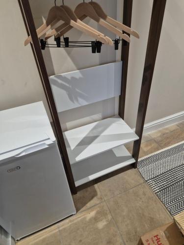 a refrigerator with its door open in a room at Striped Horse Guest House in Cape Town
