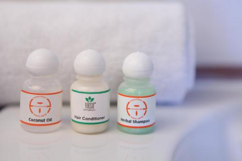 a group of three prescription bottles sitting on a table at Pondicherry Executive Inn in Puducherry