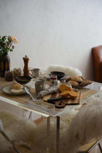 a table with some food on top of it at Cosy & Style Zell am See in Schmitten