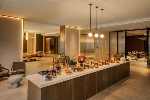 a lobby with a table with shoes on it at XO CAPE ARNNA Fethiye in Fethiye