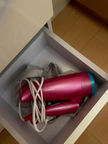 a red fire extinguisher in a box at Asteras City Apartments in Chios
