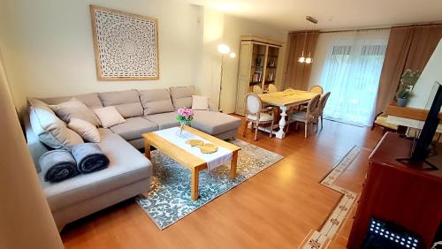 a living room with a couch and a table at Zacisze Stasia Ustroń 