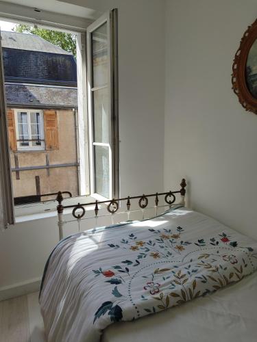 Ένα ή περισσότερα κρεβάτια σε δωμάτιο στο Chez Paulette