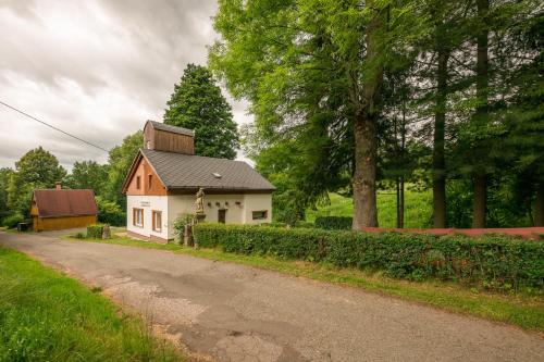 a small house on the side of a road at Bike chata Klopenka na Trutnov Trails in Trutnov