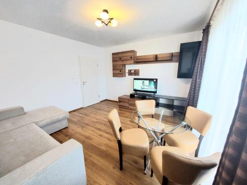 Televisyen dan/atau pusat hiburan di Brasov Altipiani Apartments