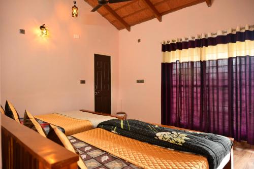 two beds sitting in a room with curtains at DELIGHTFUL HOMESTAY in Sollebail