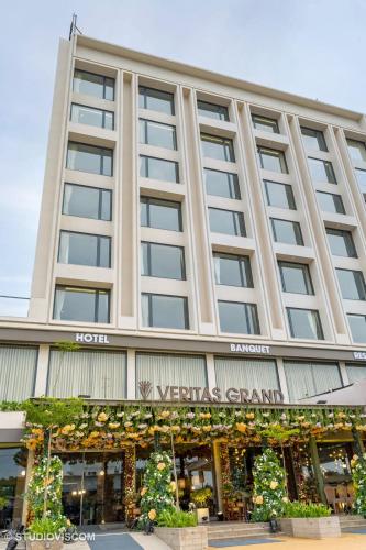 a hotel front view of a building at Hotel Veritas Grand in Sānand