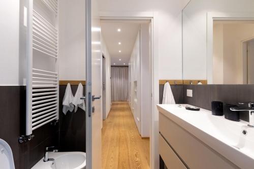 a bathroom with a sink and a toilet and a mirror at Domus Portofino - Relax & Live the Italian Riviera in Santa Margherita Ligure