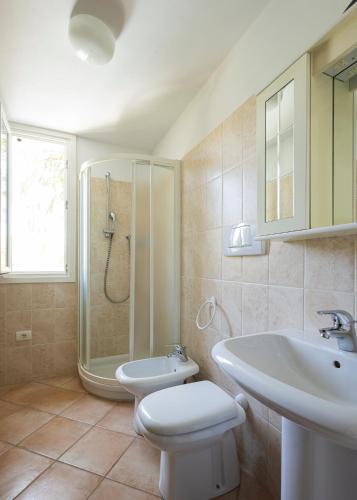 a bathroom with a sink and a toilet and a shower at U Ciousu by Ligurian Life APPARTAMENTI IN AGRITURISMO in Vallebona