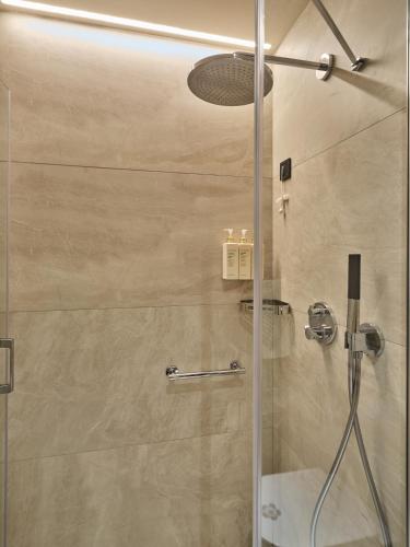 a shower with a glass door in a bathroom at Four-G Hotel Premium in Istanbul