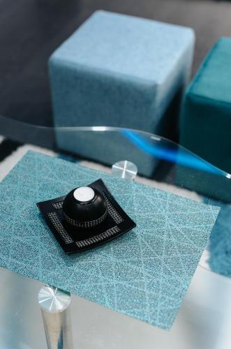 a black remote control sitting on top of a table at Apartment Drincic II in Brčko