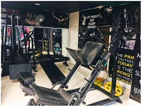 a gym with two treadmills and cardio machines at Hotel Aliza Palace Ajmer AC OR NON AC ROOM in Ajmer