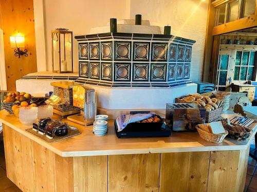 a kitchen with a counter with food on it at Salzburger Dolomitenhof in Annaberg im Lammertal