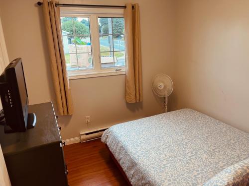 Ένα ή περισσότερα κρεβάτια σε δωμάτιο στο The Comfort Pearl