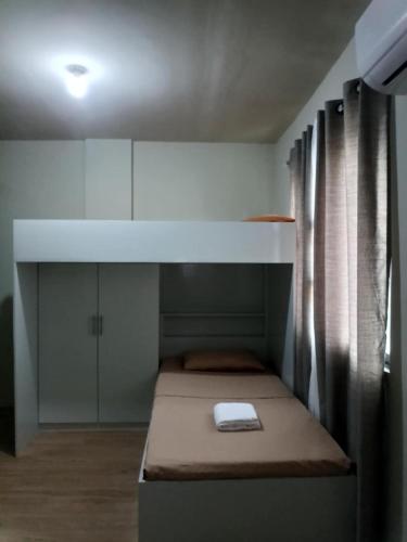 Ένα ή περισσότερα κρεβάτια σε δωμάτιο στο The Nuebes Townhouse CDO