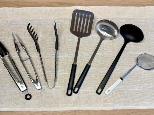 a group of kitchen utensils sitting on a table at Minpaku SAKURA 民泊 戸建貸切 彦根城まで車10分 無料駐車場 普通2台小型1台 in Hikone
