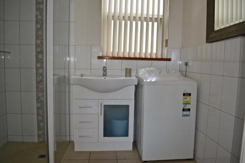 Kuchyň nebo kuchyňský kout v ubytování Longbeach Apartments