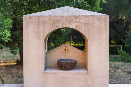a small bird house with a bowl in it at San Filadelfo 