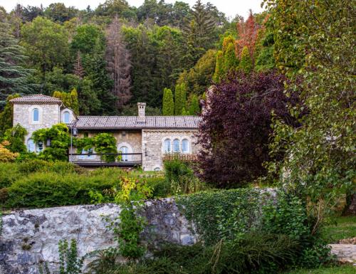 a stone house in the middle of a forest at Beauregard Jura - Countryside Estate Stays Near Geneva in Gex