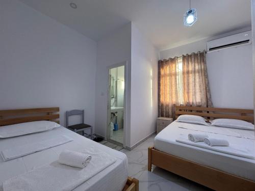Postel nebo postele na pokoji v ubytování Hotel A & V Dodani