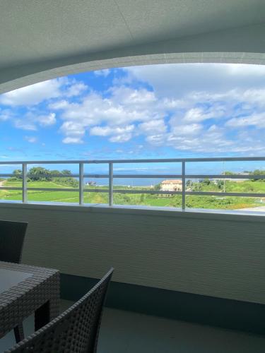 a large window in a room with a view of the ocean at アオイカゼ in Awaji