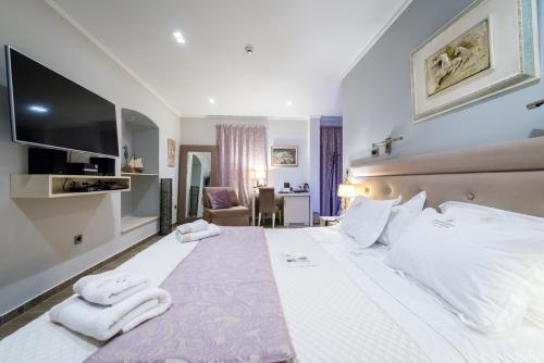 Katil atau katil-katil dalam bilik di Fiscardonna Luxury Suites