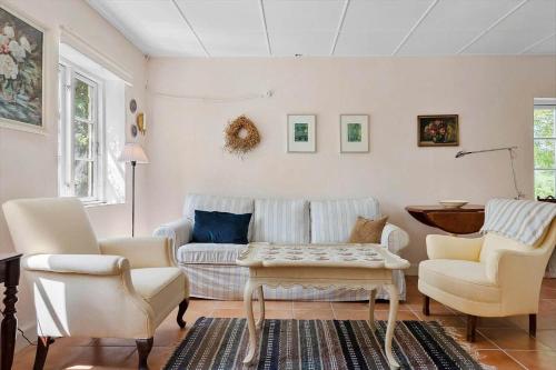 a living room with a couch and two chairs at 4037-Borre-Sondre-Landevej-37 in Borre
