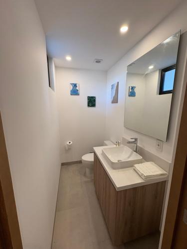 a bathroom with a sink and a mirror at Family-Friendly Oceanview Retreat Resort Access in Cabo San Lucas