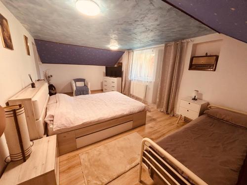 Ένα ή περισσότερα κρεβάτια σε δωμάτιο στο Cottage Luca