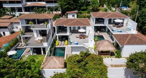 an aerial view of a house with a swimming pool at The Guu Villas - Luxe Seaview Villa Resort in Ko Lanta