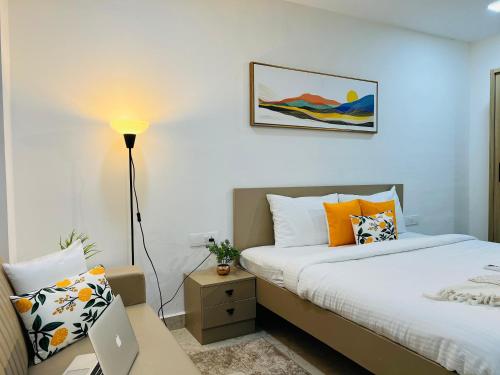 Ένα ή περισσότερα κρεβάτια σε δωμάτιο στο Olive Serviced Apartments - HICC Hyderabad
