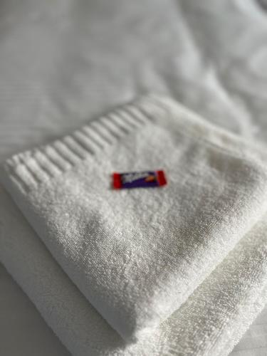 a small red item sitting on top of a white blanket at Apartmány Lipovina in Malá Tŕňa