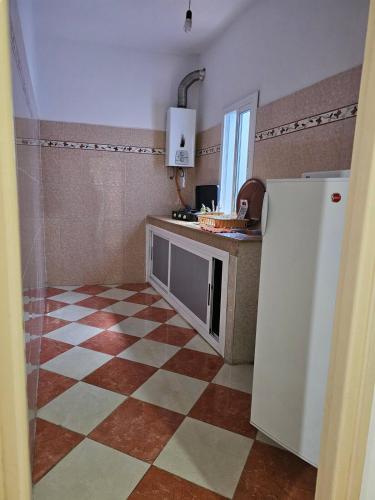 Una cocina o zona de cocina en Ammour Apartment