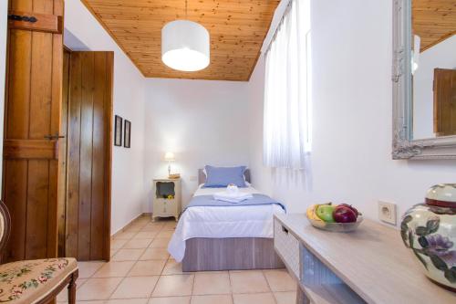 Ένα ή περισσότερα κρεβάτια σε δωμάτιο στο Villa Christini