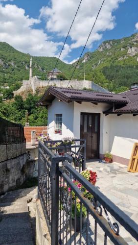a house with a fence in front of it at Apartment Plava Voda in Travnik