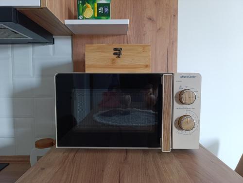 a microwave oven sitting on top of a kitchen counter at Apartment Eight - Pirot in Pirot