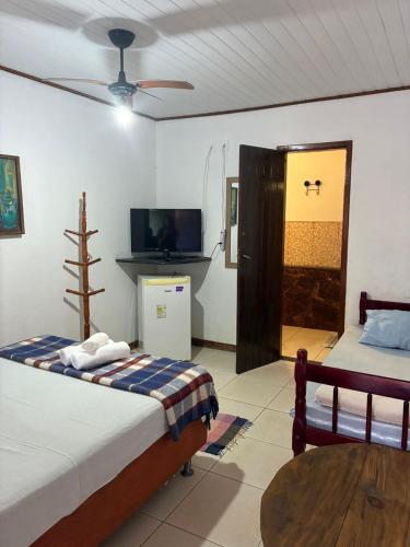 Katil atau katil-katil dalam bilik di Pousada & Hostel Bicho Preguiça