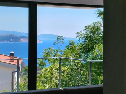 a view of the water from a living room window at Villa vista mare in Zagrađe