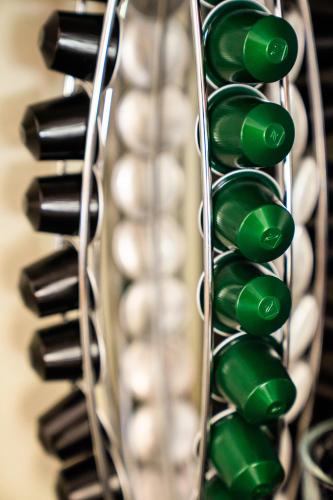 a bunch of green wine bottles in a wine rack at Sonnmatten Boutique Hotel & Apartments Zermatt in Zermatt