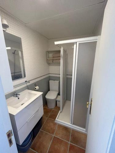 a bathroom with a sink and a toilet at Granada I Apartment- Patalavaca in Patalavaca